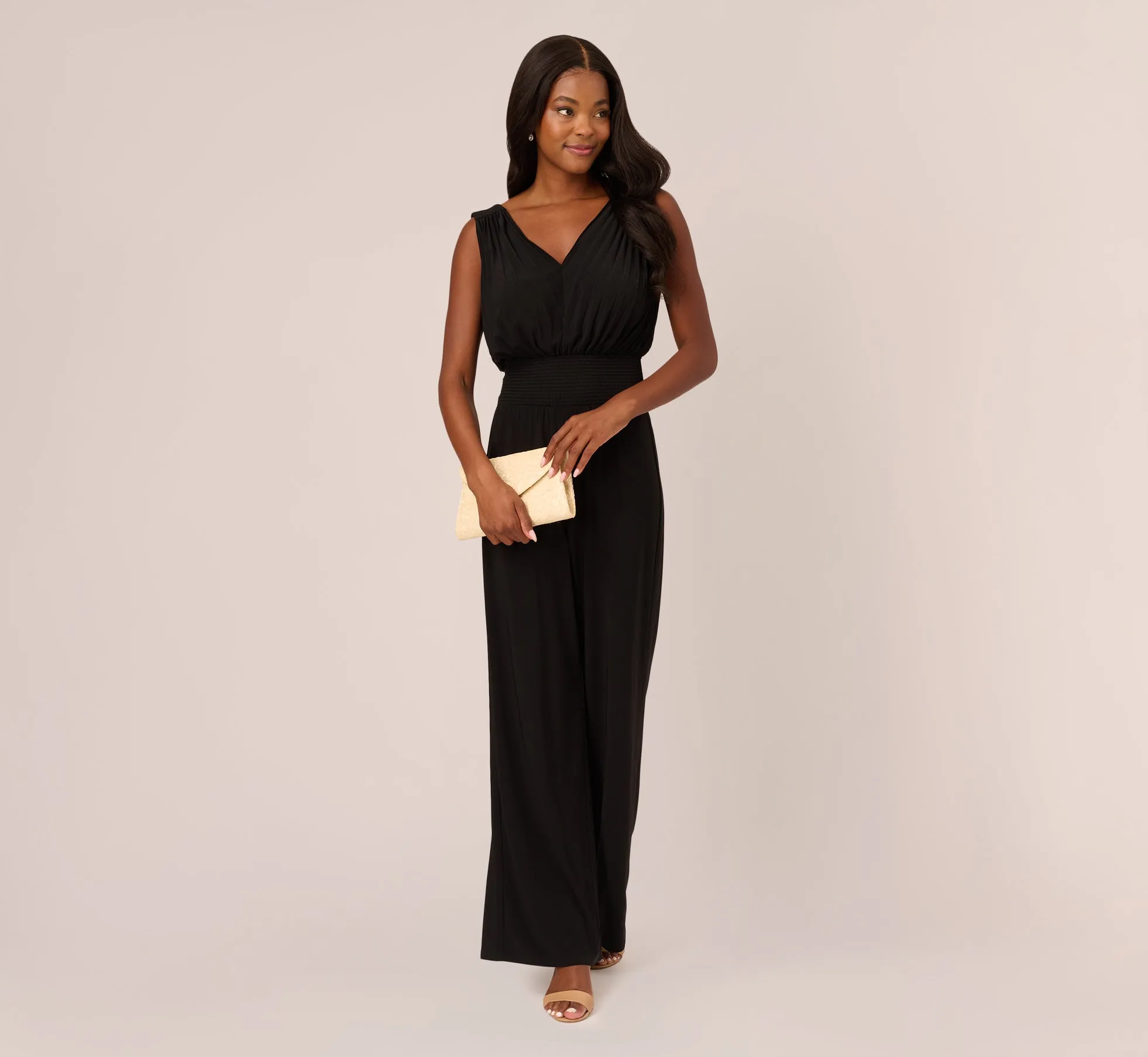 Sleeveless Smocked Jumpsuit With V-Neckline In Black