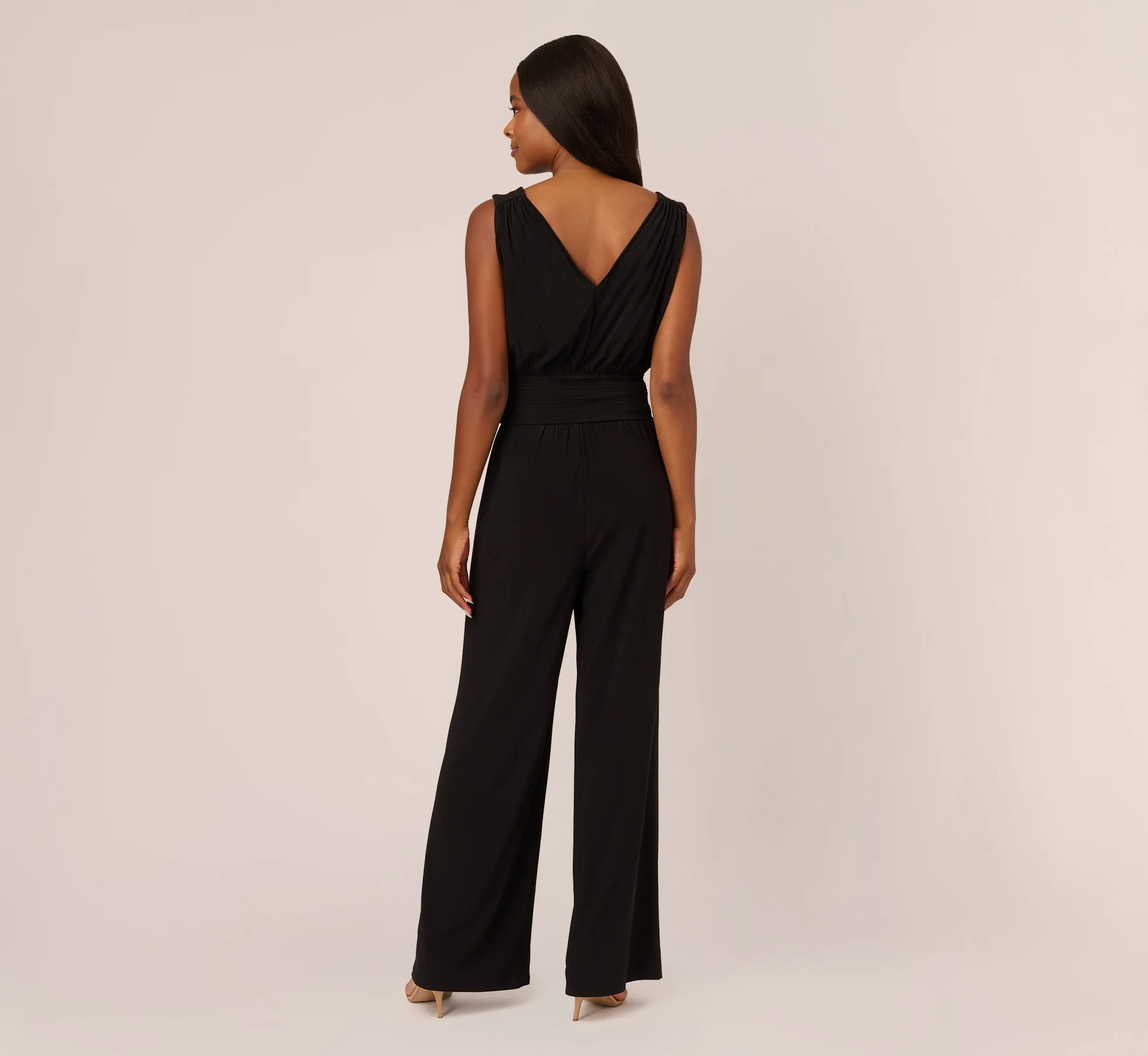 Sleeveless Smocked Jumpsuit With V-Neckline In Black