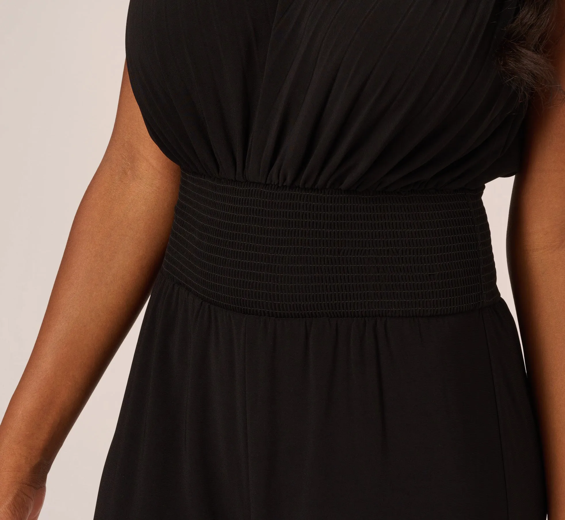 Sleeveless Smocked Jumpsuit With V-Neckline In Black